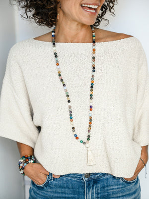 abundance mixed gemstone mala necklace with moonstone guru bead and cream colored tassel | radiant malas | handmade in boulder, colorado
