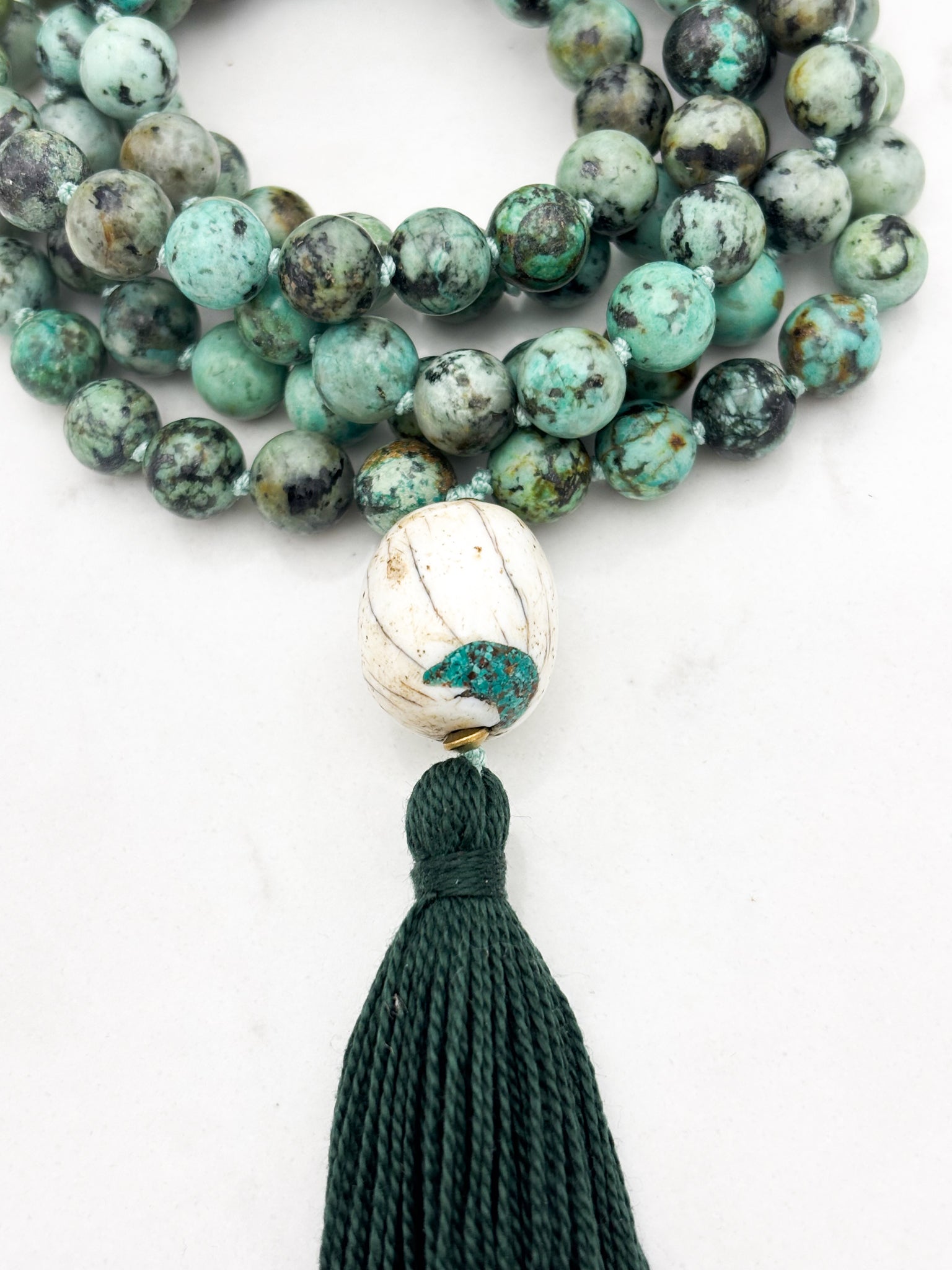 African turquoise gemstone mala with bone guru bead and dark green tassel | radiant malas | handmade in boulder, colorado
