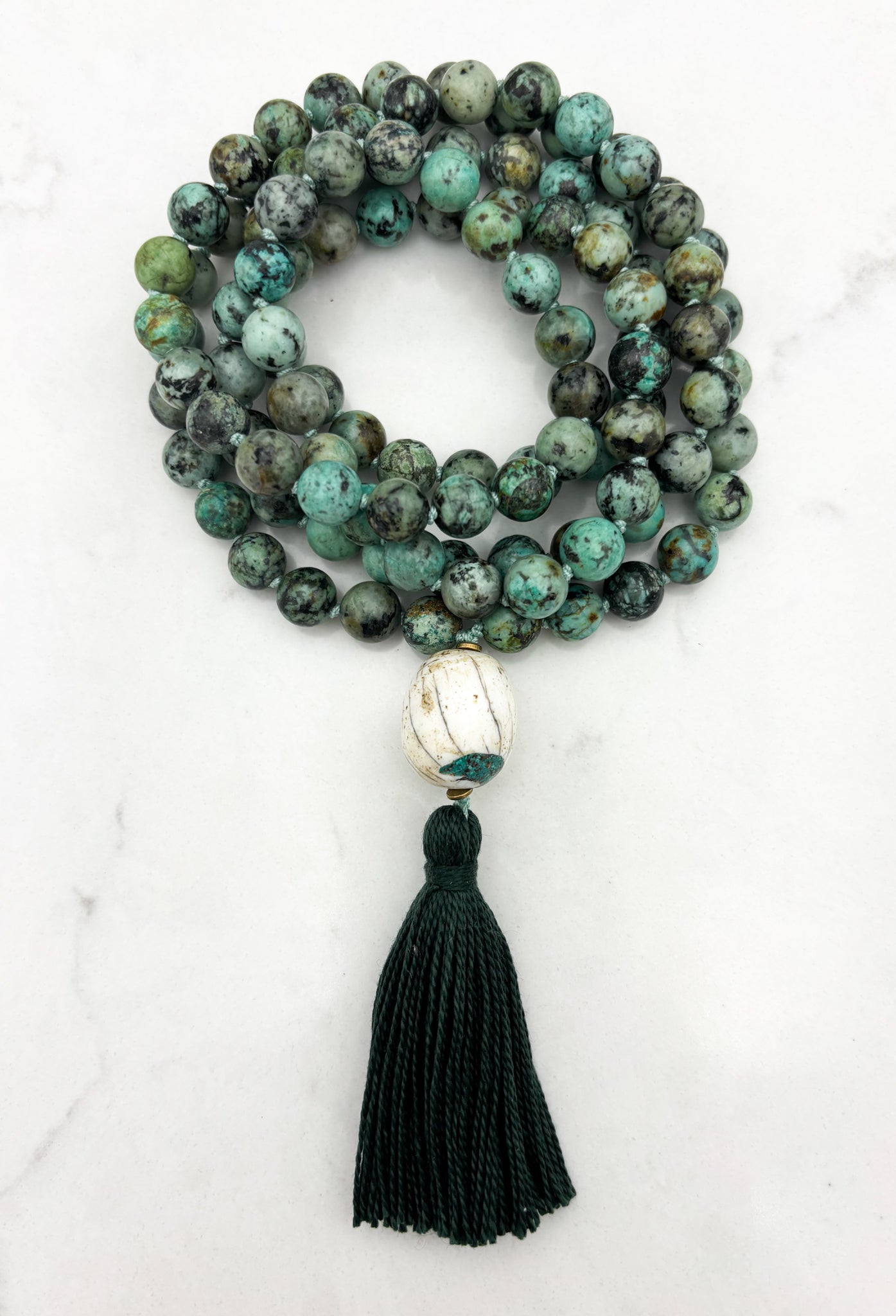 African turquoise gemstone mala with bone guru bead and dark green tassel | radiant malas | handmade in boulder, colorado