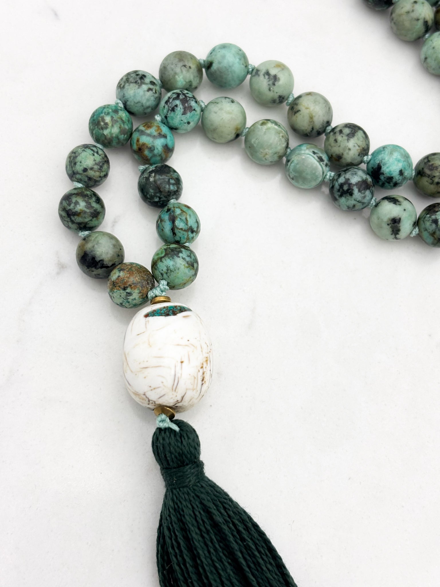African turquoise gemstone mala with bone guru bead and dark green tassel | radiant malas | handmade in boulder, colorado