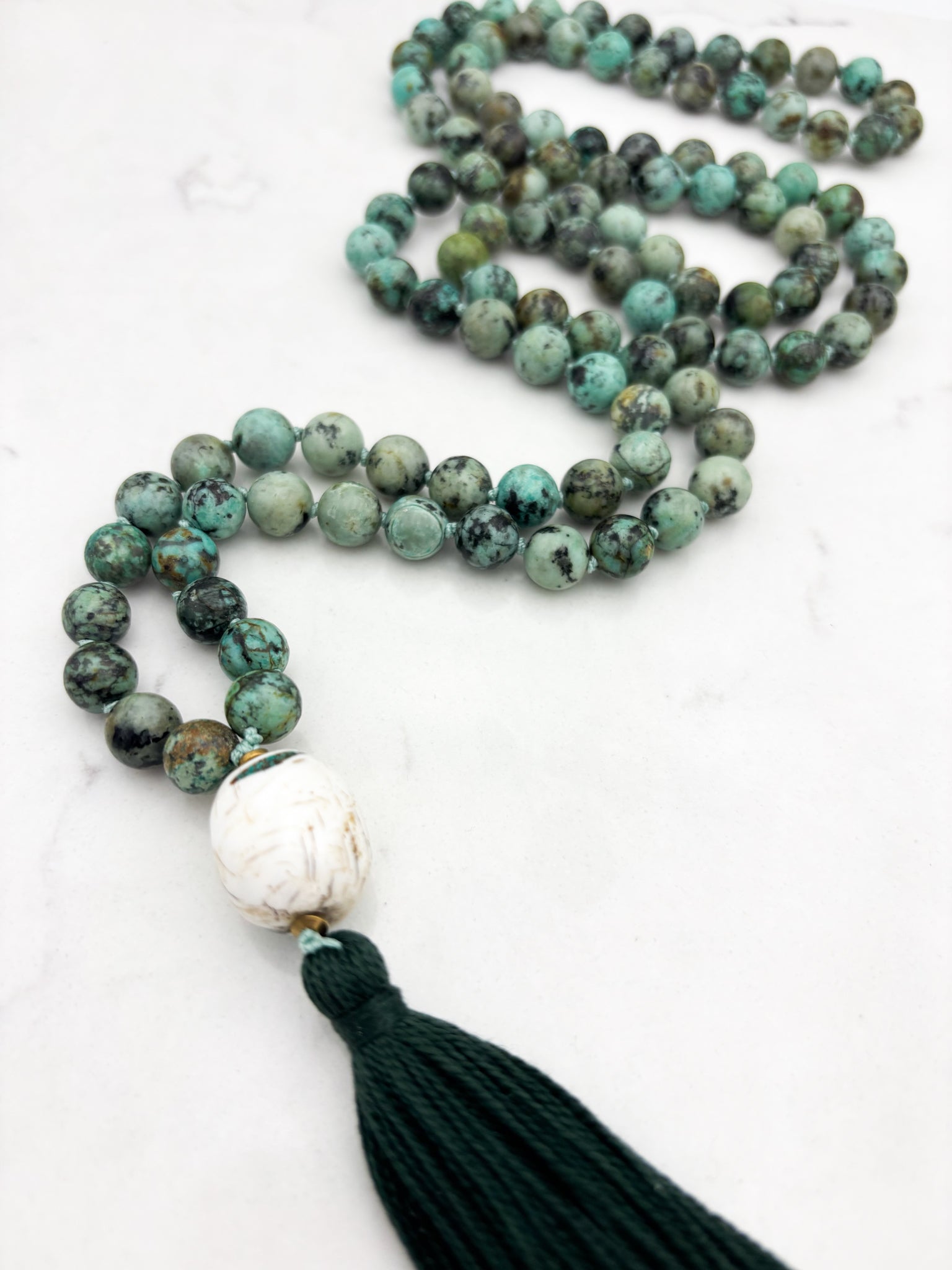 African turquoise gemstone mala with bone guru bead and dark green tassel | radiant malas | handmade in boulder, colorado