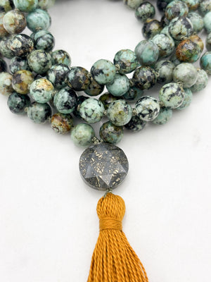 african turquoise gemstone mala with faceted pyrite guru bead and gold tassel | radiant malas | handmade in boulder, colorado