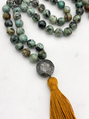 african turquoise gemstone mala with faceted pyrite guru bead and gold tassel | radiant malas | handmade in boulder, colorado