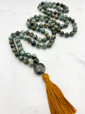 african turquoise gemstone mala with faceted pyrite guru bead and gold tassel | radiant malas | handmade in boulder, colorado