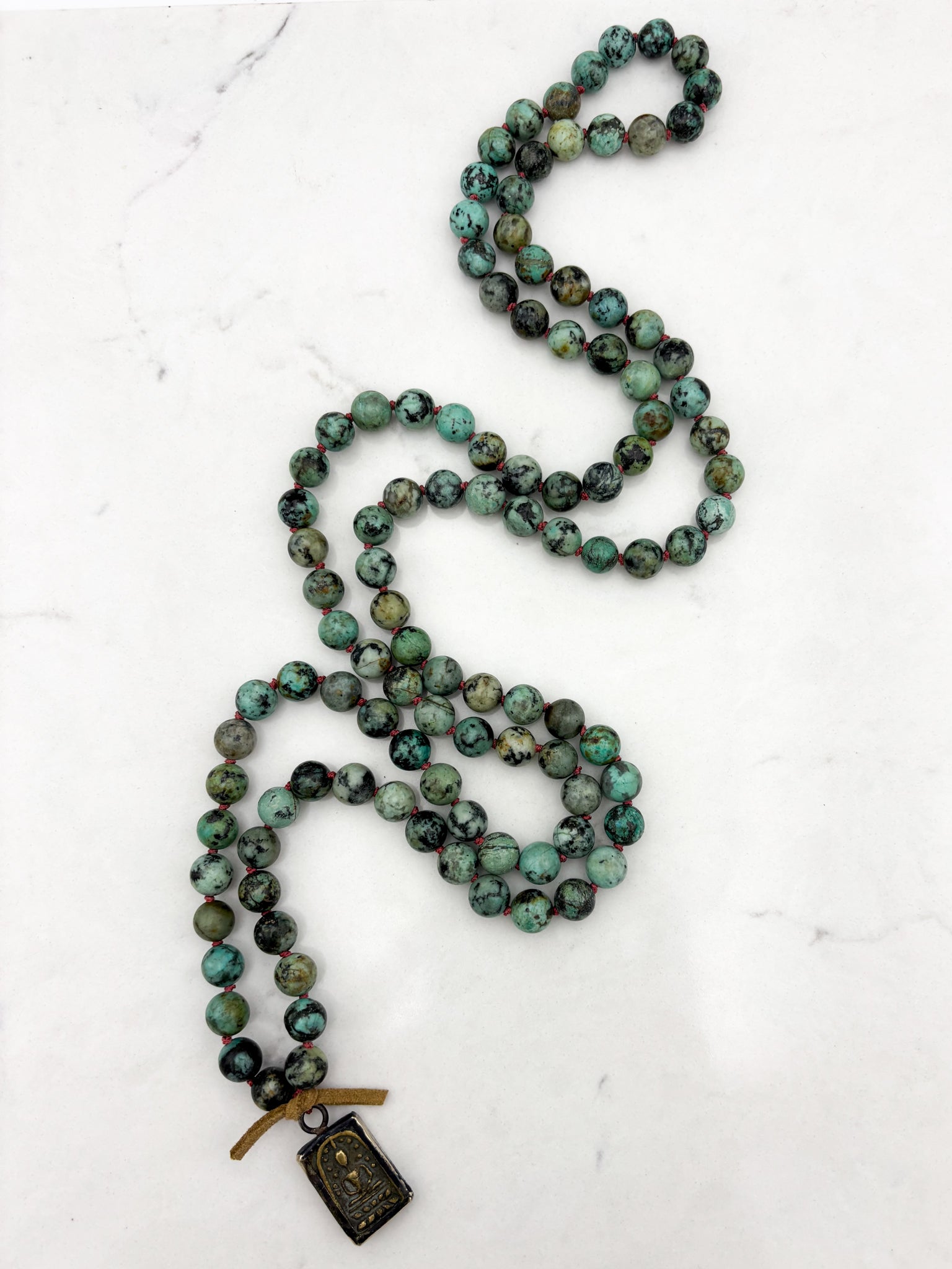african turquoise gemstone mala with brass pendant | radiant malas | handmade in boulder, colorado		