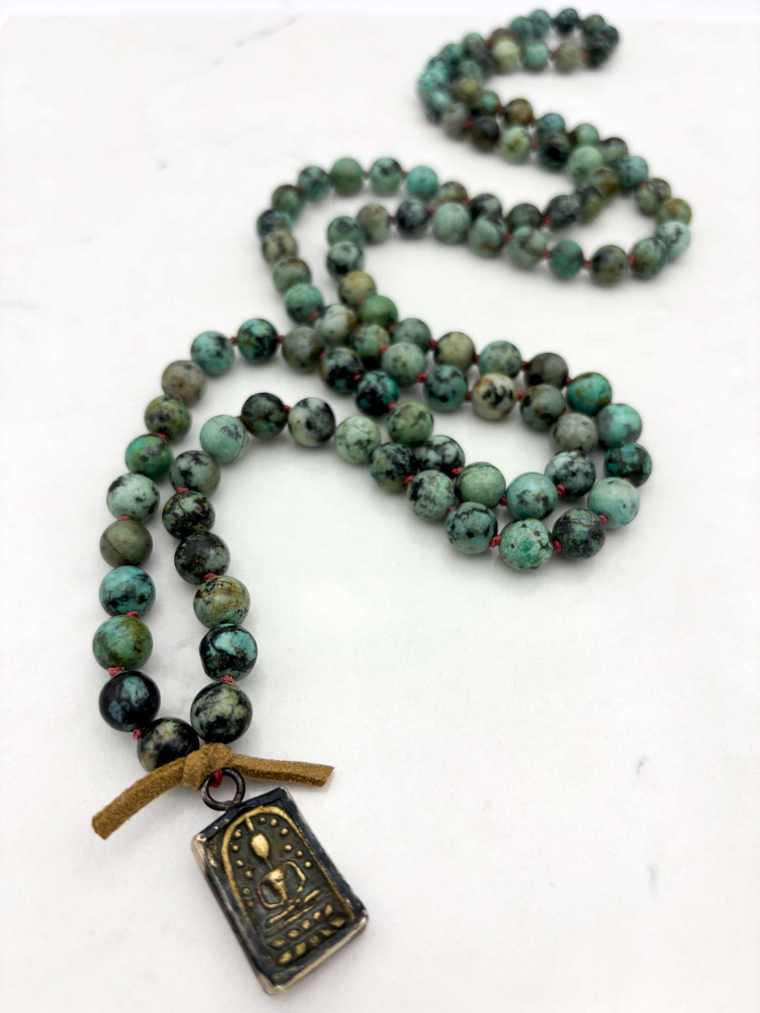 african turquoise gemstone mala with brass pendant | radiant malas | handmade in boulder, colorado																							