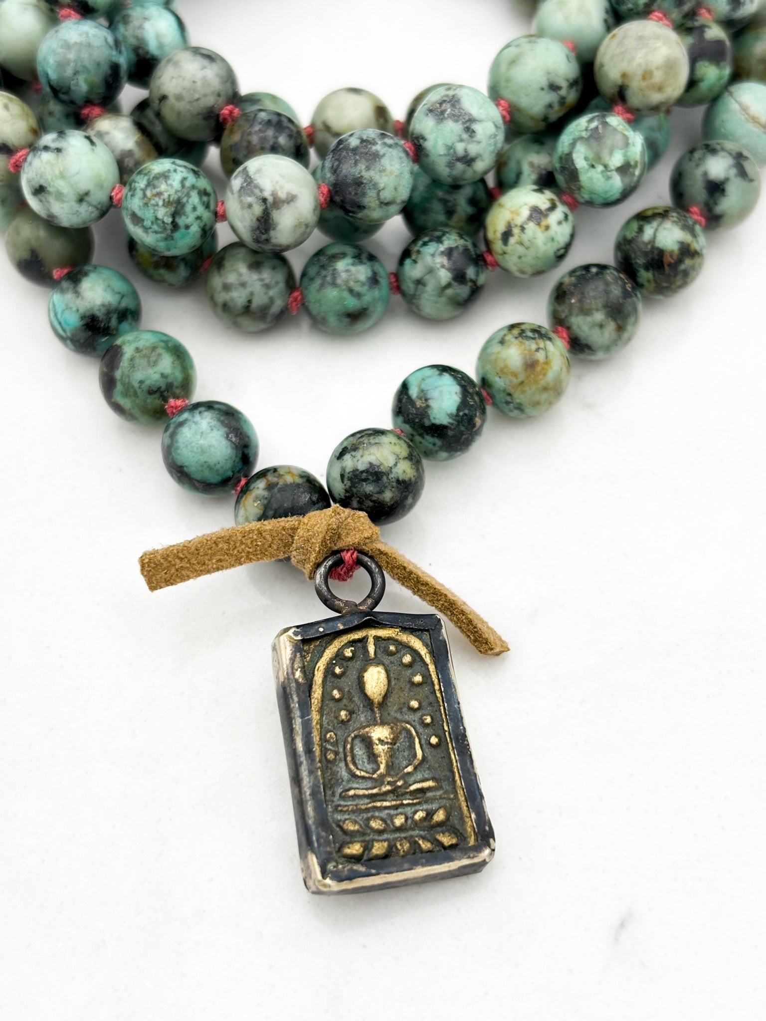 african turquoise gemstone mala with brass pendant | radiant malas | handmade in boulder, colorado																							