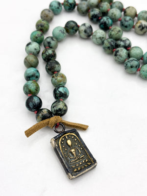 african turquoise gemstone mala with brass pendant | radiant malas | handmade in boulder, colorado		