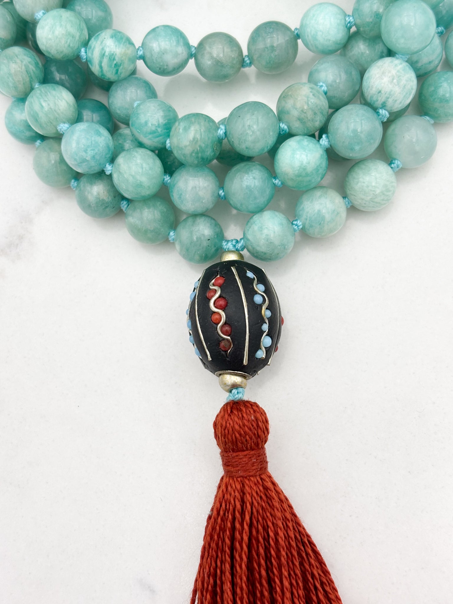 amazonite gemstone mala wtih brass with tibetan guru bead and rust colored tassel | radiant malas | handmade in boulder, colorado