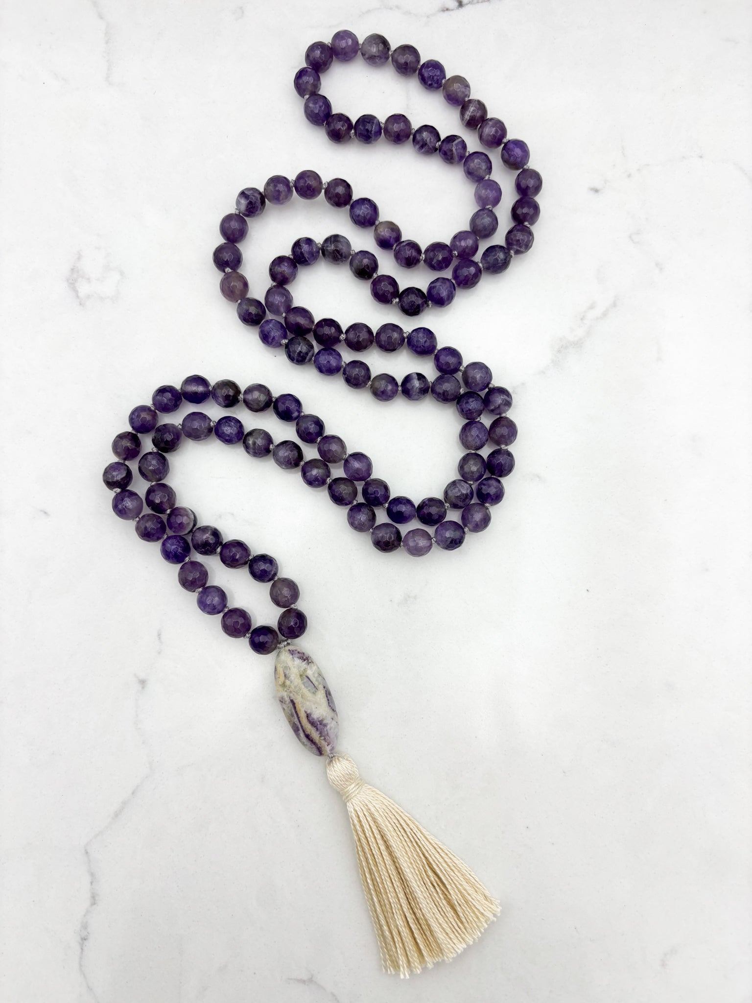 amethyst gemstone mala with chevron amethyst guru bead and cream tassel  | radiant malas | handmade in boulder, colorado