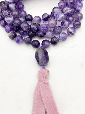 amethyst gemstone mala necklace with amethyst guru bead and pink silk ribbon tassel | radiant malas | handmade in boulder, colorado