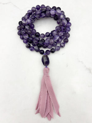 amethyst gemstone mala necklace with amethyst guru bead and pink silk ribbon tassel | radiant malas | handmade in boulder, colorado