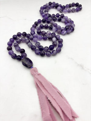 amethyst gemstone mala necklace with amethyst guru bead and pink silk ribbon tassel | radiant malas | handmade in boulder, colorado