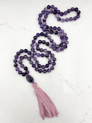 amethyst gemstone mala necklace with amethyst guru bead and pink silk ribbon tassel | radiant malas | handmade in boulder, colorado
