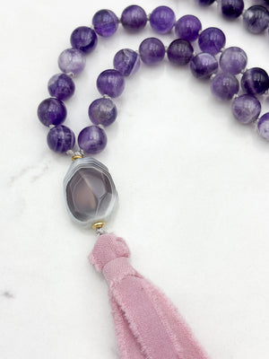 amethyst gemstone mala necklace with botswana agate guru bead and pink silk ribbon tassel | radiant malas | handmade in boulder, colorado