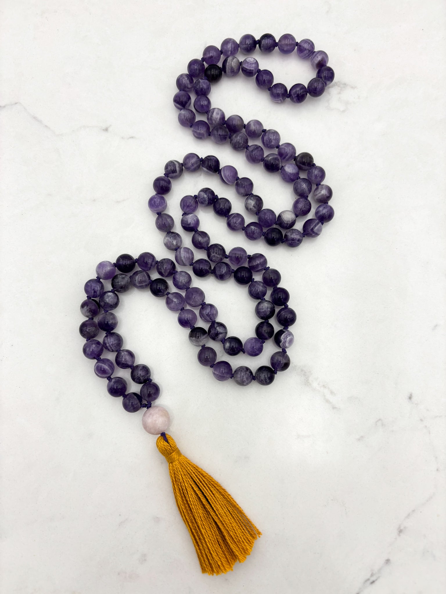 amethyst gemstone mala necklace with kunzite guru bead and gold tassel | radiant malas | handmade in boulder, colorado