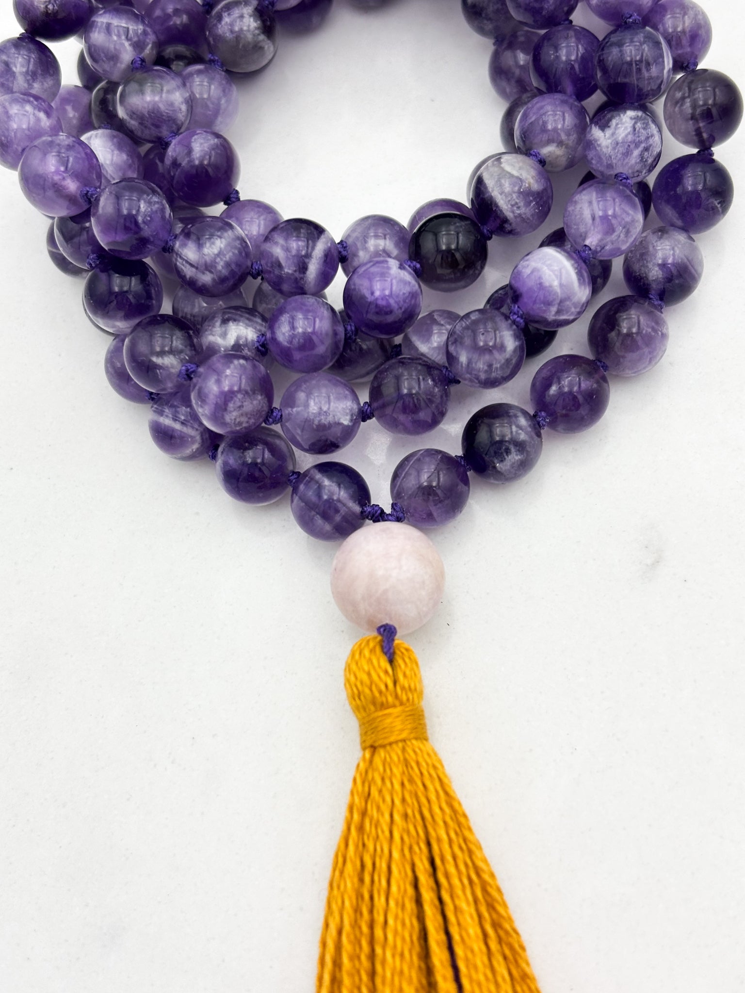 amethyst gemstone mala necklace with kunzite guru bead and gold tassel | radiant malas | handmade in boulder, colorado