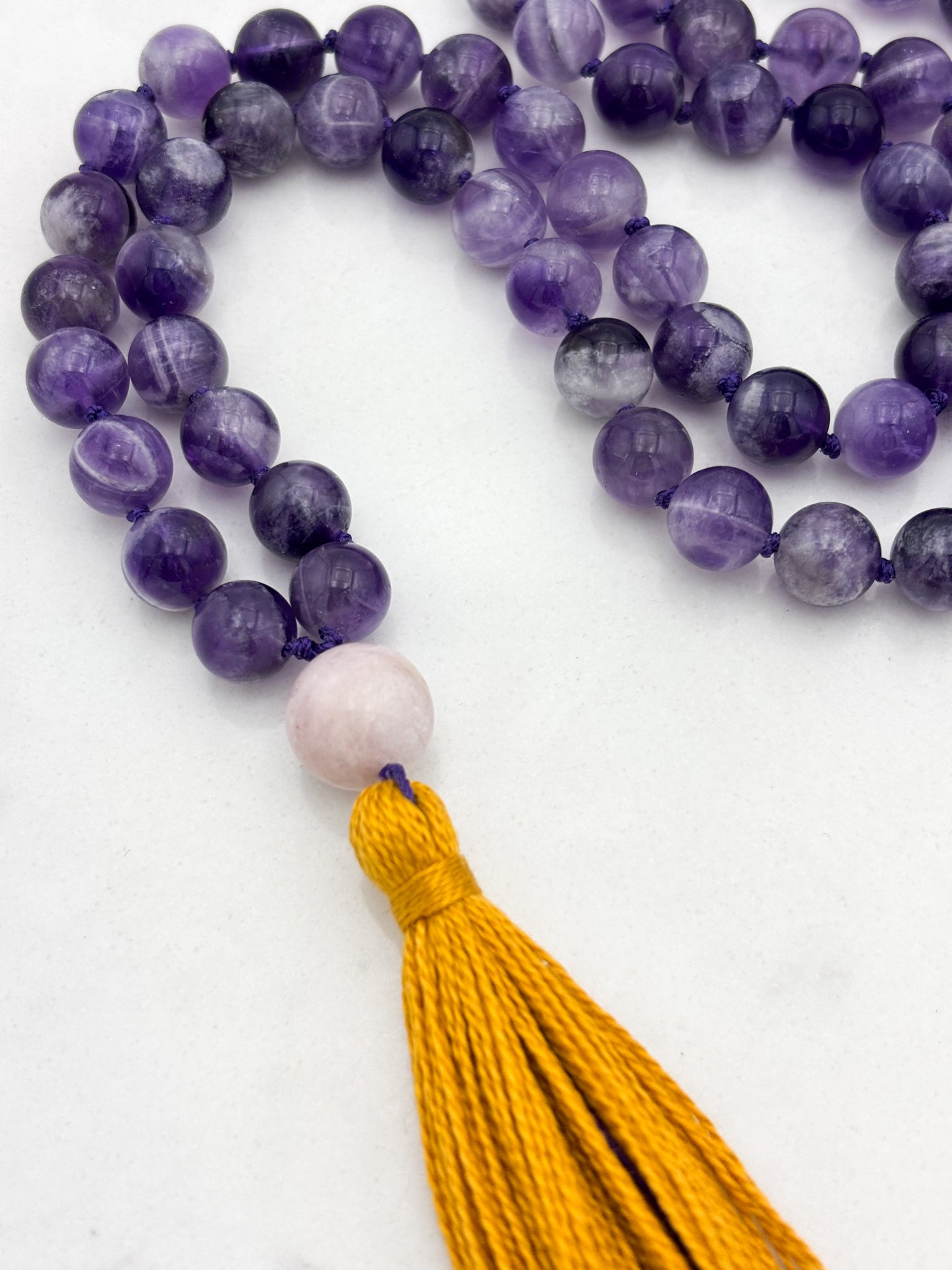 amethyst gemstone mala necklace with kunzite guru bead and gold tassel | radiant malas | handmade in boulder, colorado
