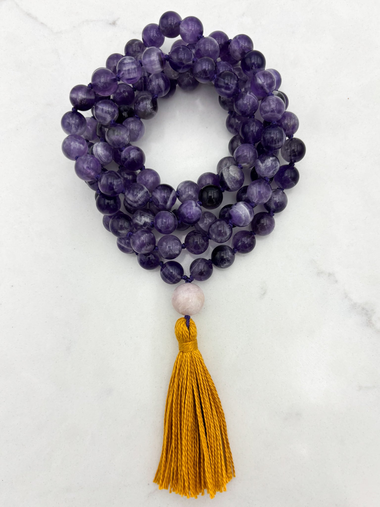amethyst gemstone mala necklace with kunzite guru bead and gold tassel | radiant malas | handmade in boulder, colorado