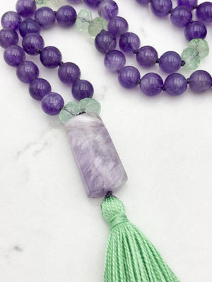 amethyst and fluorite gemstone mala with pink amethyst guru bead and green tassel | radiant malas | handmade in boulder, colorado