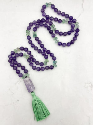 amethyst and fluorite gemstone mala with pink amethyst guru bead and green tassel | radiant malas | handmade in boulder, colorado