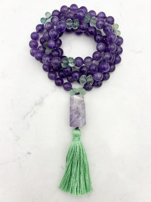 amethyst and fluorite gemstone mala with pink amethyst guru bead and green tassel | radiant malas | handmade in boulder, colorado