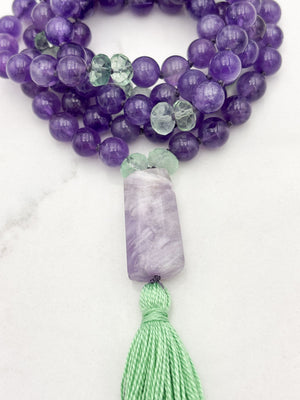 amethyst and fluorite gemstone mala with pink amethyst guru bead and green tassel | radiant malas | handmade in boulder, colorado