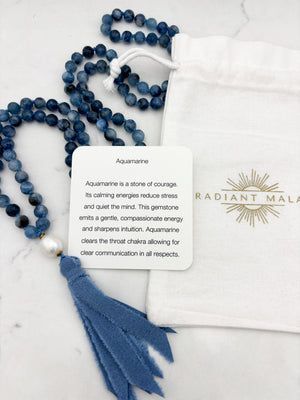 aquamarine gemstone mala with freshwater pearl uru bead and blue silk ro=ibbon tassel | radiant malas 
 handmade in boulder, colorado