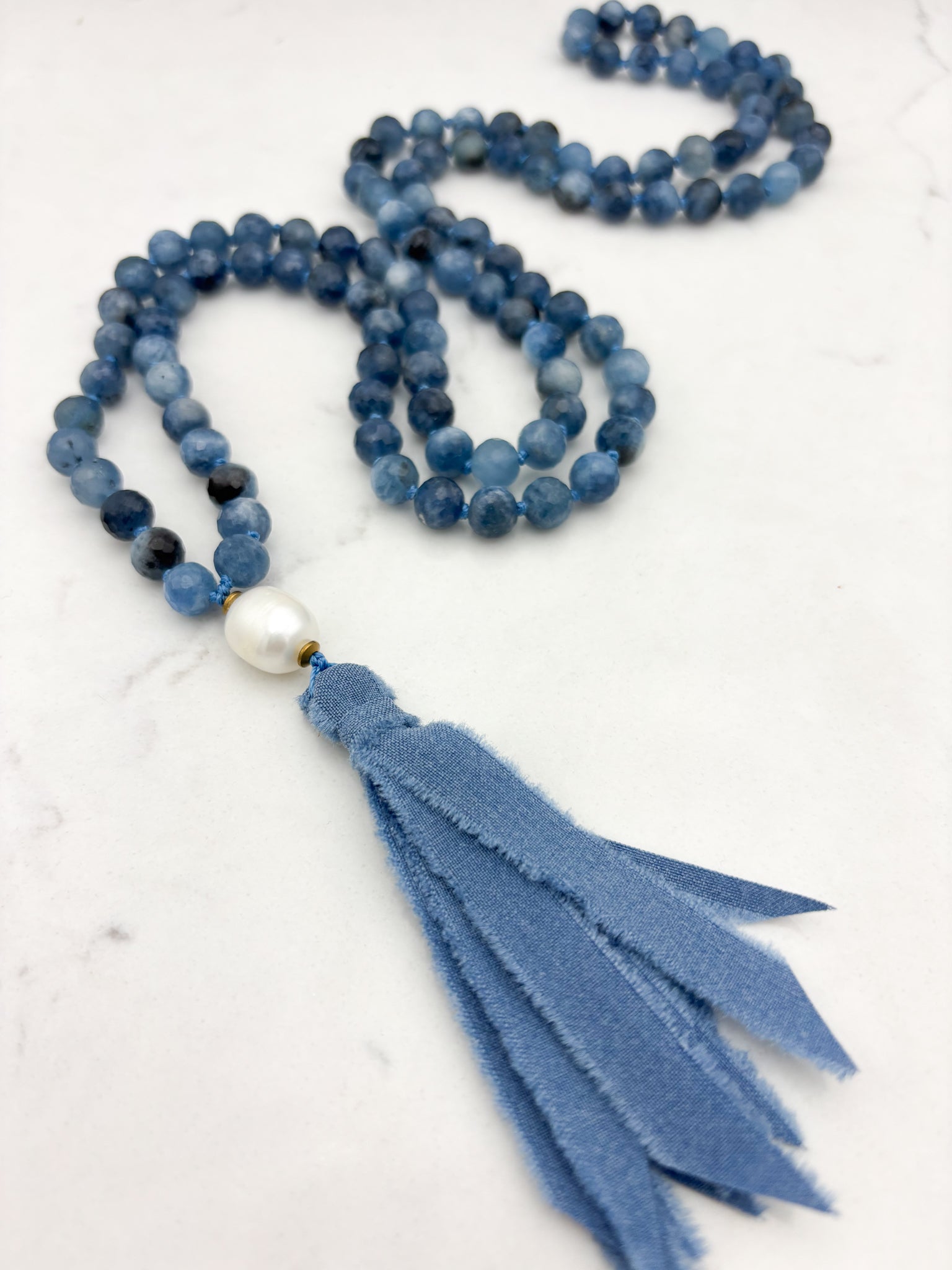 aquamarine gemstone mala with freshwater pearl uru bead and blue silk ro=ibbon tassel | radiant malas 
 handmade in boulder, colorado