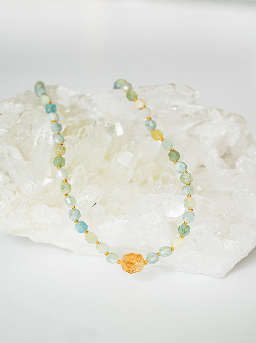 aquamarine knotted gemstone necklace with citrine guru bead | radiant malas | handmade in boulder, colorado