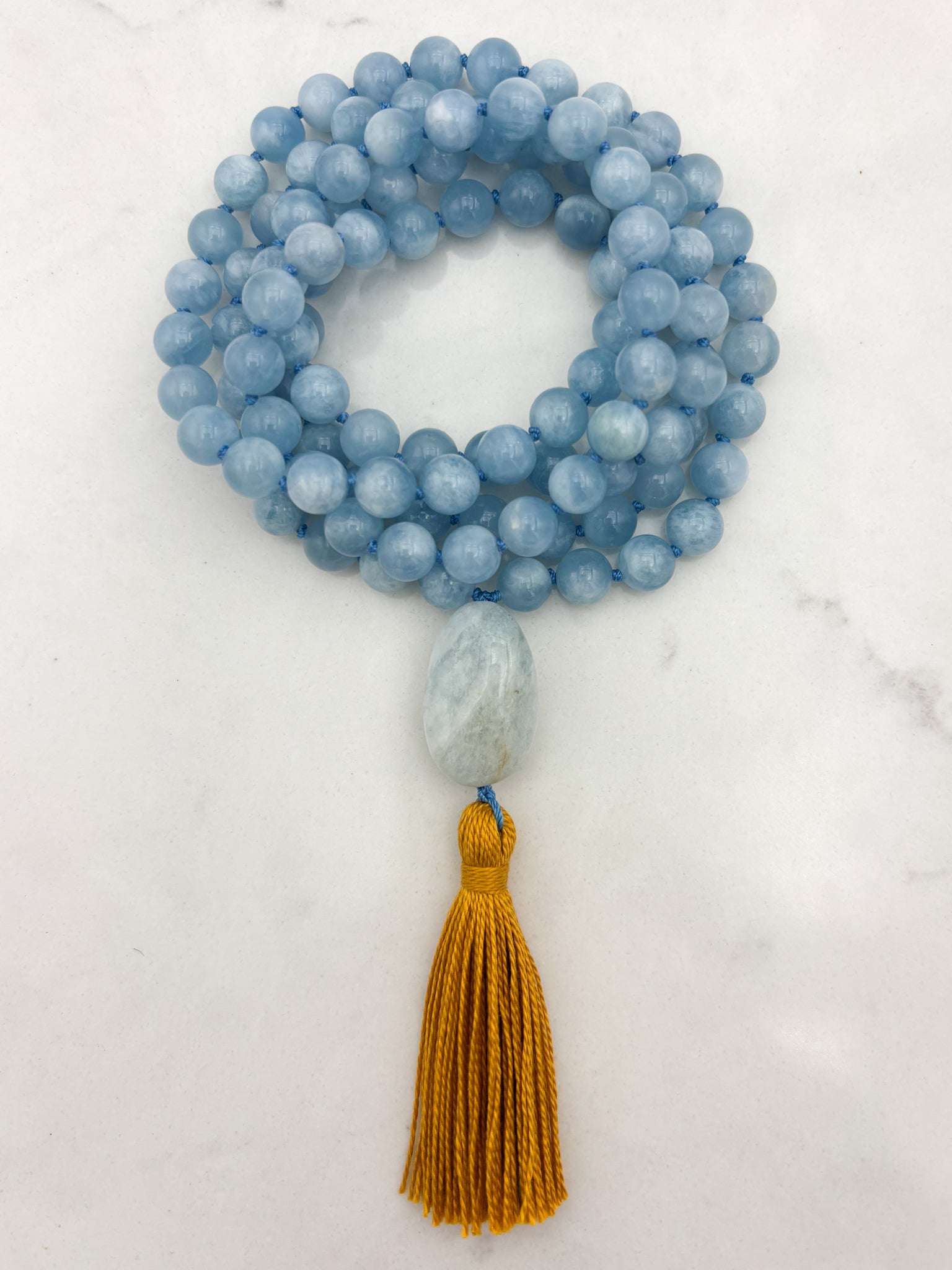 aquamarine gemstone mala with aquamarine guru bead and gold tassel | radiant malas | handmade in boulder, colorado