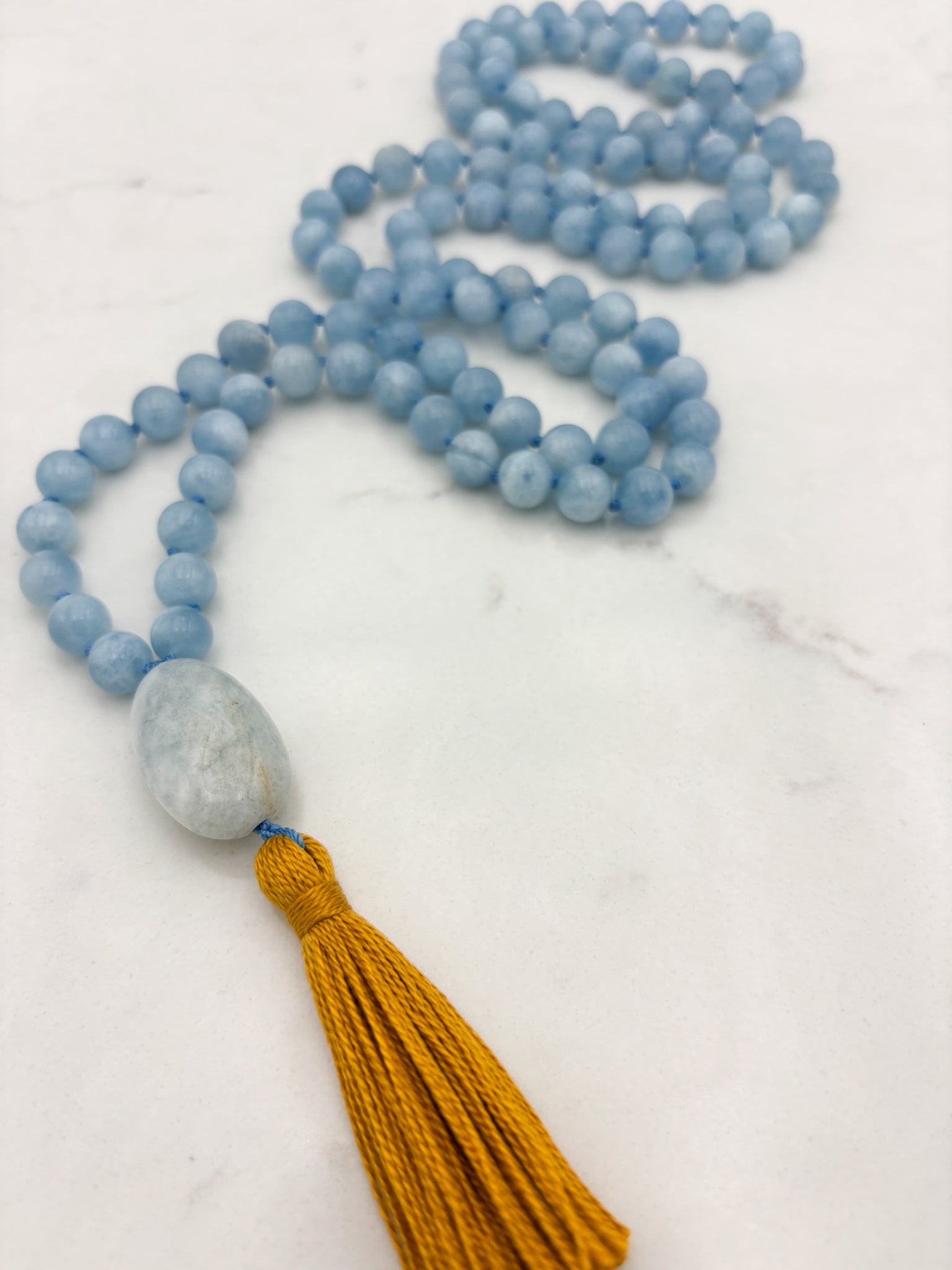 aquamarine gemstone mala with aquamarine guru bead and gold tassel | radiant malas | handmade in boulder, colorado