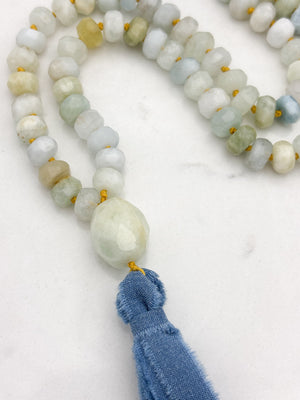 aquamarine gemstone mala with aquamarine guru bead and blue silk ribbon tassel | radiant malas 
 handmade in boulder, colorado