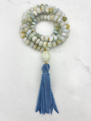 aquamarine gemstone mala with aquamarine guru bead and blue silk ribbon tassel | radiant malas 
 handmade in boulder, colorado