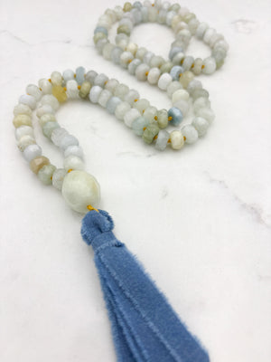 aquamarine gemstone mala with aquamarine guru bead and blue silk ribbon tassel | radiant malas 
 handmade in boulder, colorado