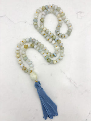 aquamarine gemstone mala with aquamarine guru bead and blue silk ribbon tassel | radiant malas 
 handmade in boulder, colorado