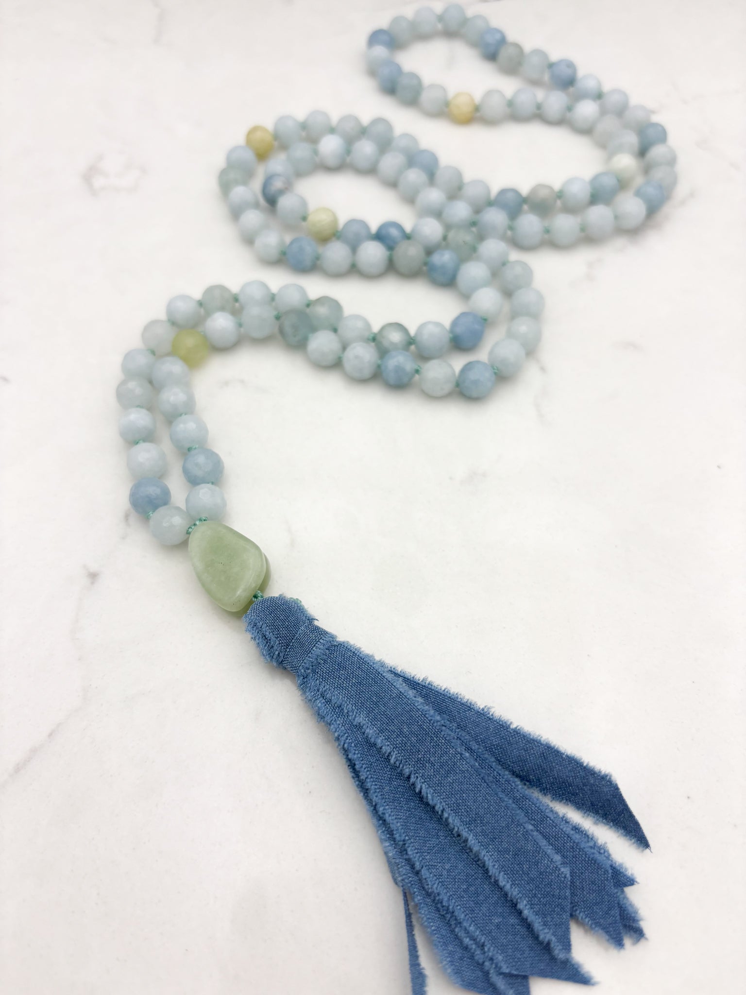 aquamarine gemstone mala with jade guru bead and blue silk tassel | radiant malas | handmade in boulder, colorado