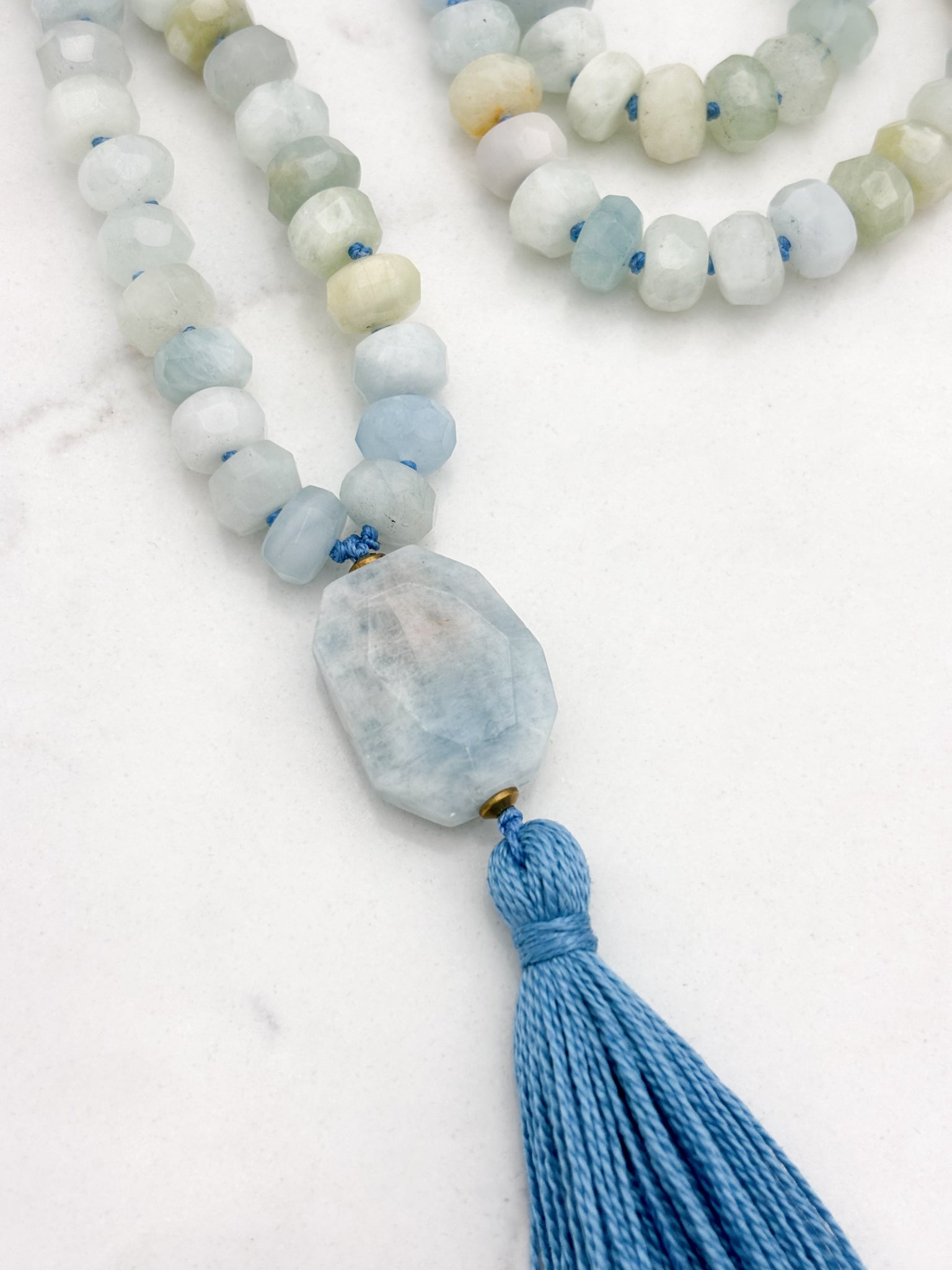 aquamarine gemstone mala necklace with aquamarine guru bead and blue tassel | radiant malas | handmade in boulder, colorado
