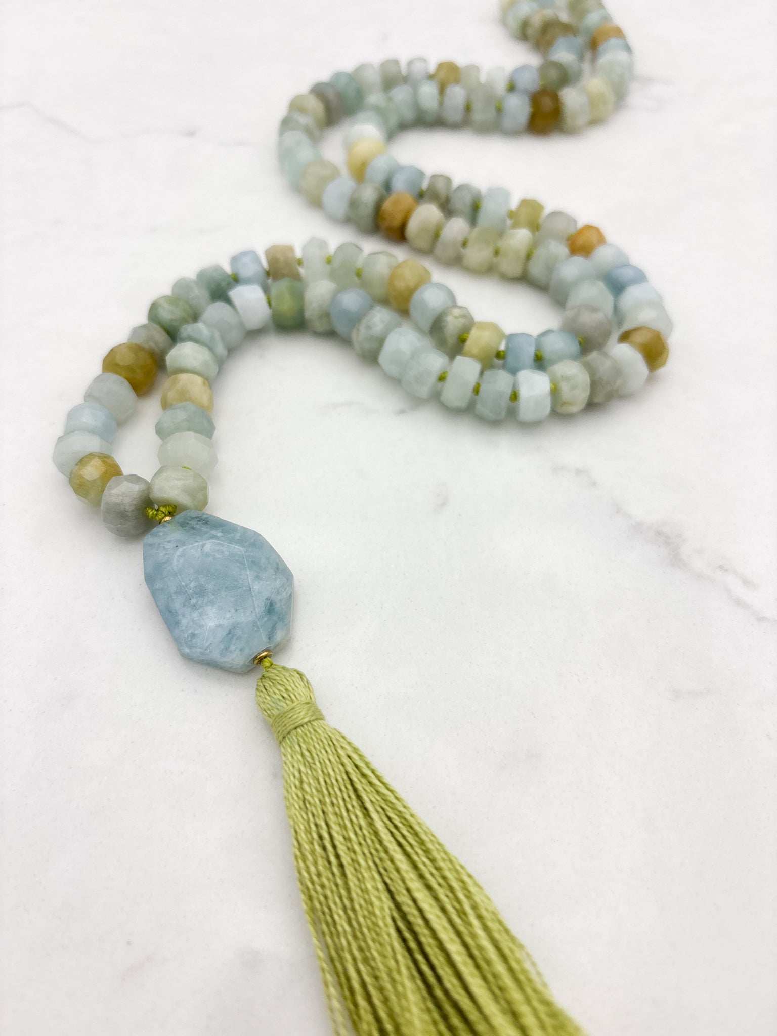 aquamarine gemstone mala necklace with aquamarine guru bead and green tassel | radiant malas | handmade in boulder, colorado