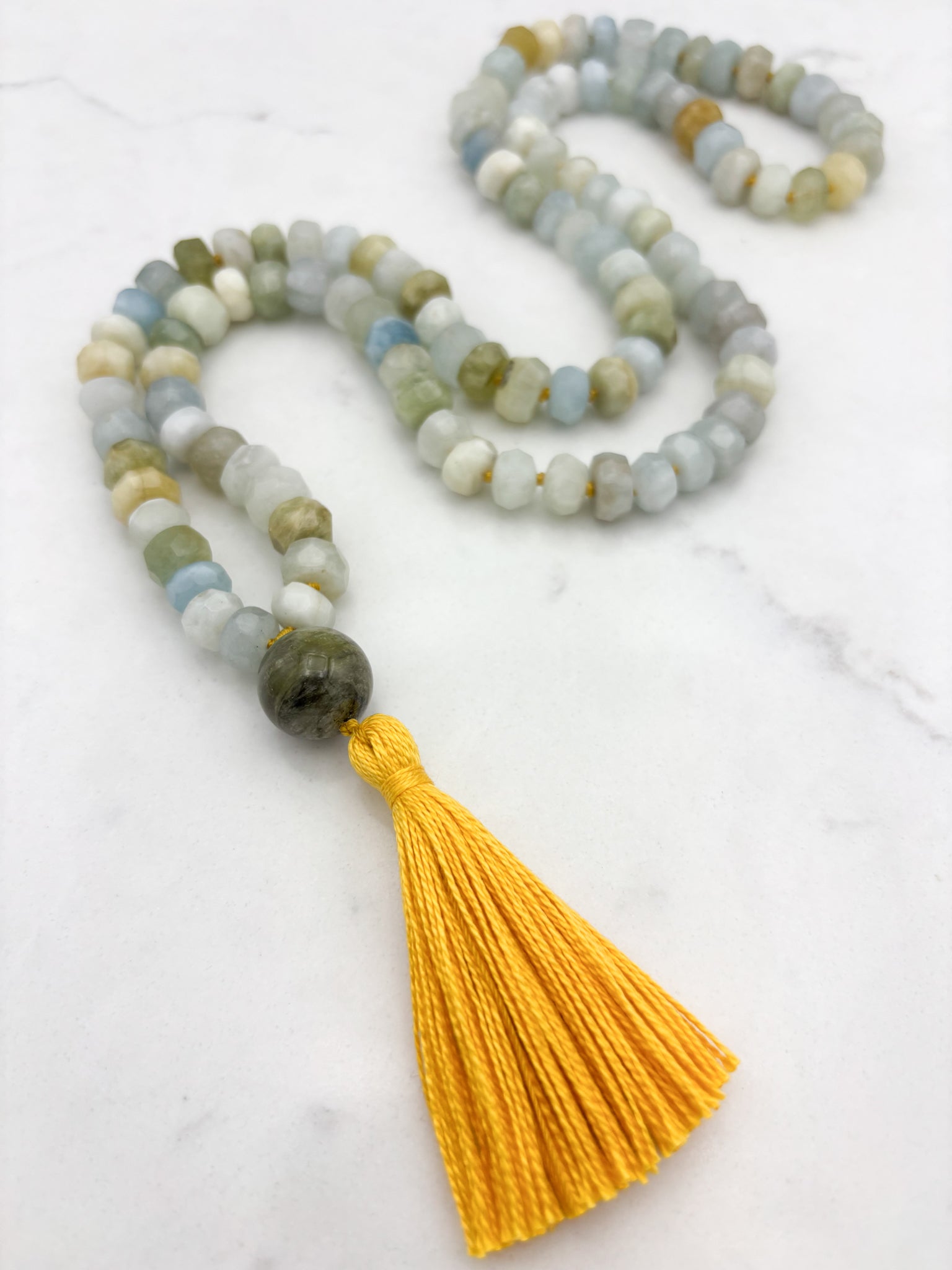 aquamarine gemstone mala necklace with cat's eye tourmaline guru bead and yellow tassel | radiant malas | handmade in boulder, colorado