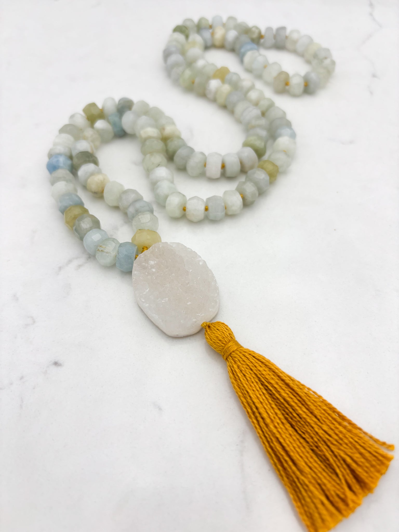 aquamarine gemstone mala necklace with druzy quartz guru bead and gold tassel | radiant malas | handmade in boulder, colorado