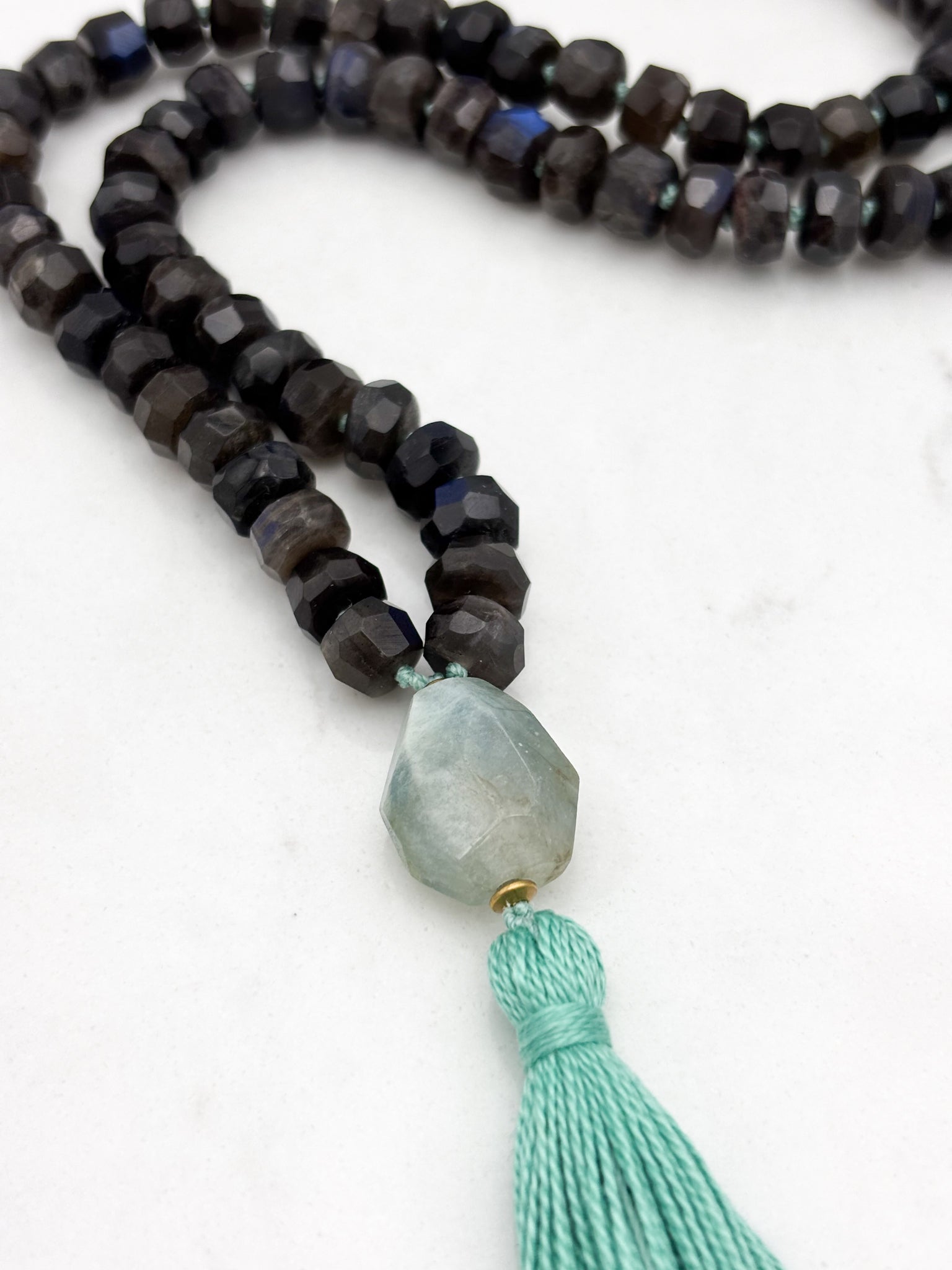 black labradorite gemstone mala with aquamarine bead and teal tassel | radiant malas | handmade in boulder, colorado
