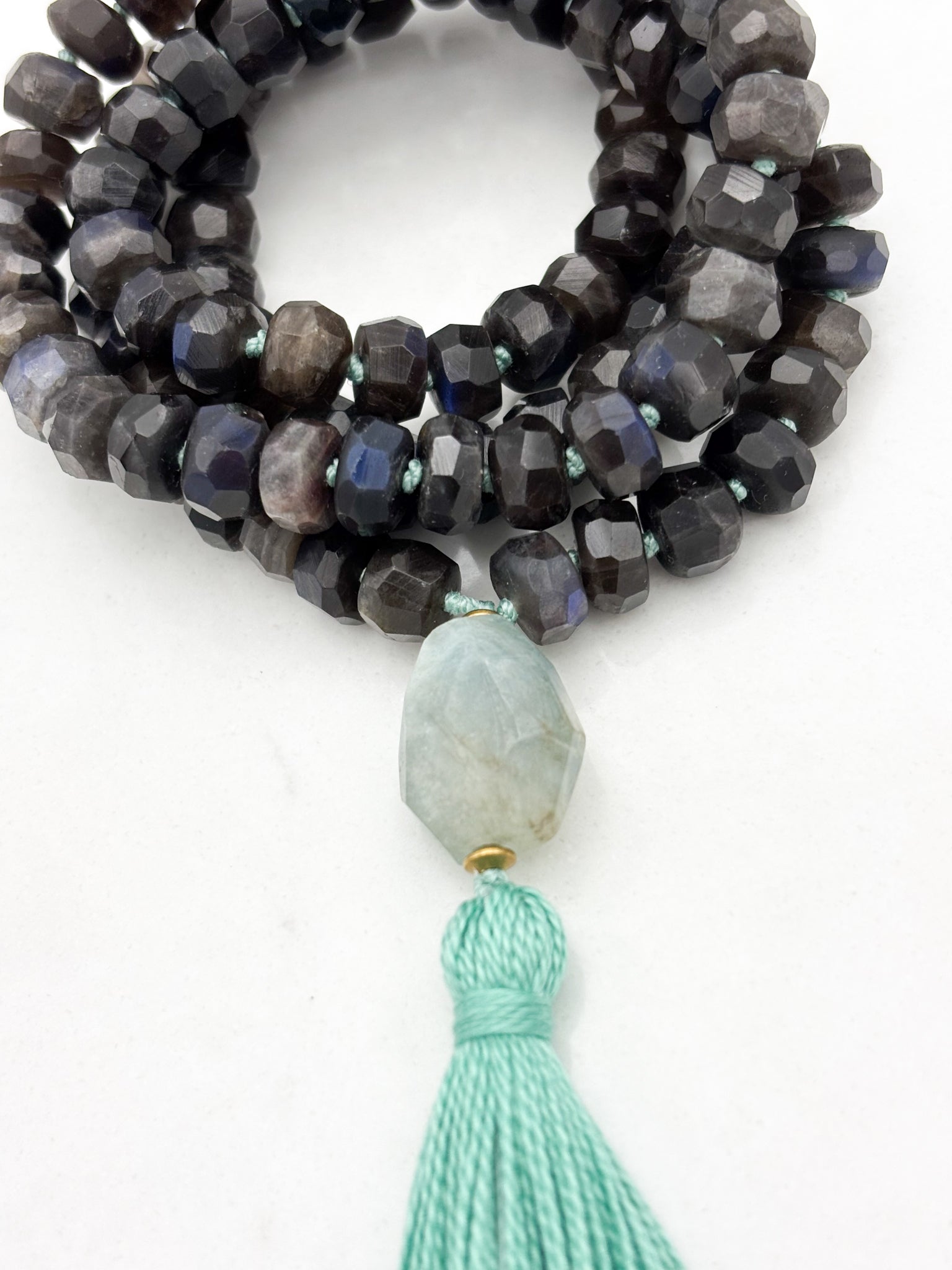 black labradorite gemstone mala with aquamarine bead and teal tassel | radiant malas | handmade in boulder, colorado