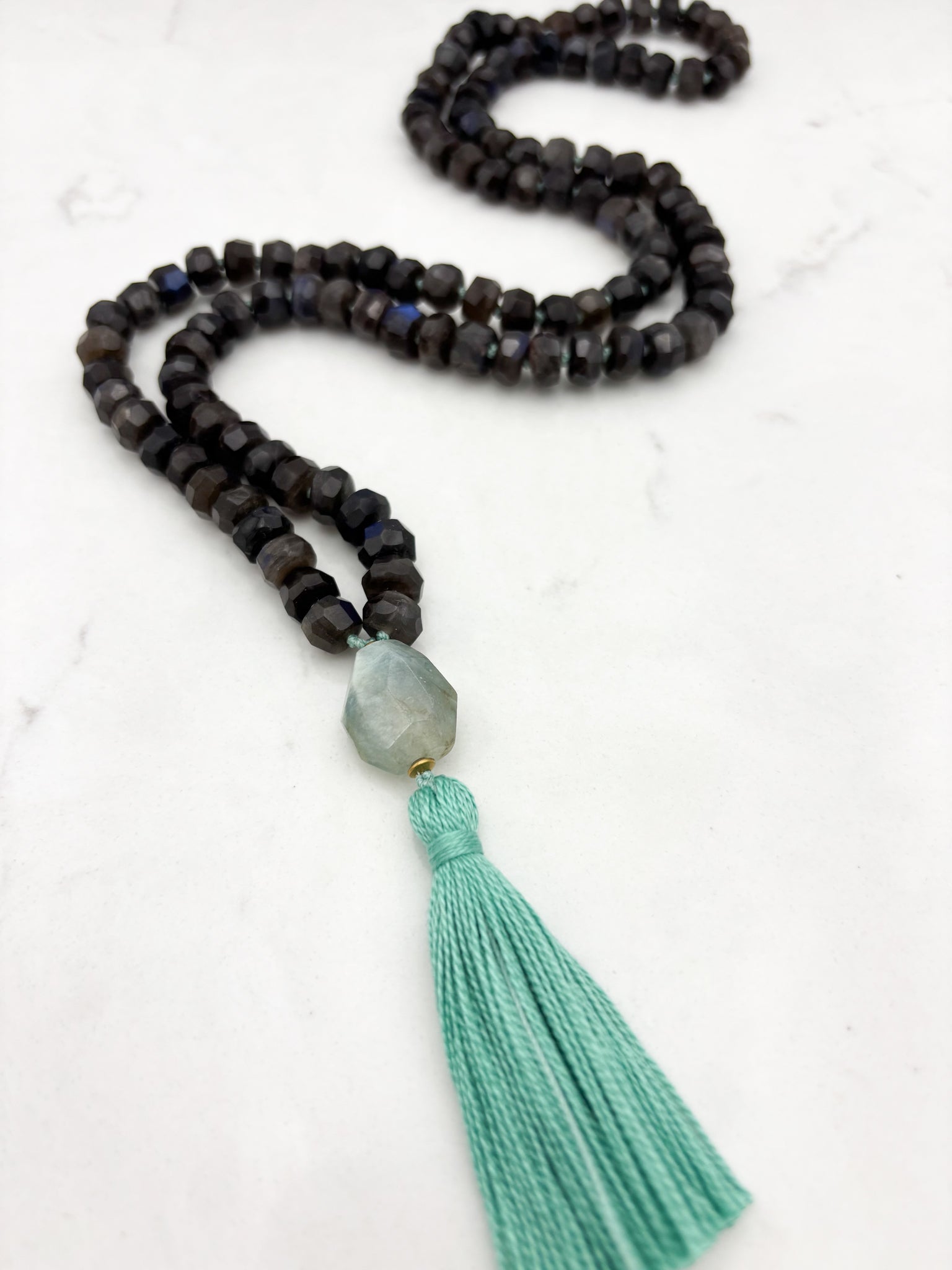 black labradorite gemstone mala with aquamarine bead and teal tassel | radiant malas | handmade in boulder, colorado