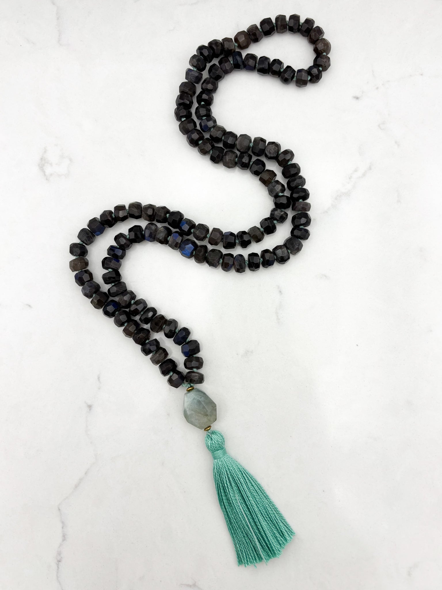 black labradorite gemstone mala with aquamarine bead and teal tassel | radiant malas | handmade in boulder, colorado