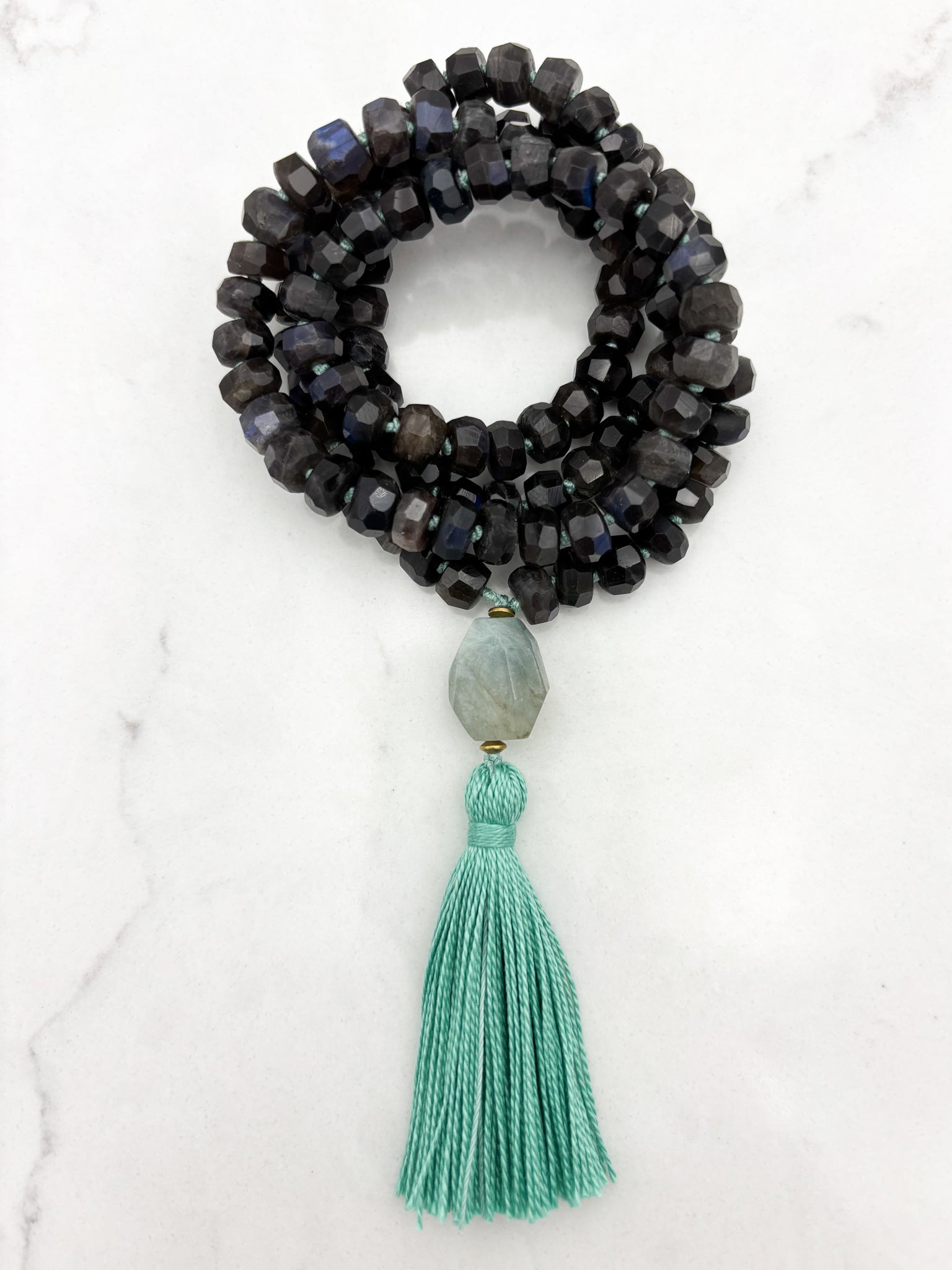 black labradorite gemstone mala with aquamarine bead and teal tassel | radiant malas | handmade in boulder, colorado