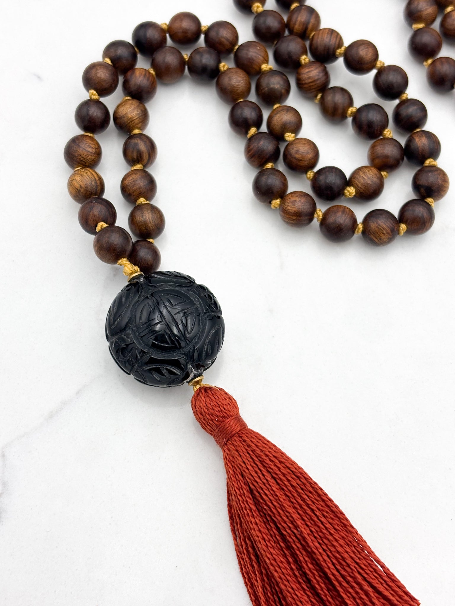 black rosewood mala necklace with onyx guru bead and ruse tassel | radiant Malas | handmade in boulder, colorado