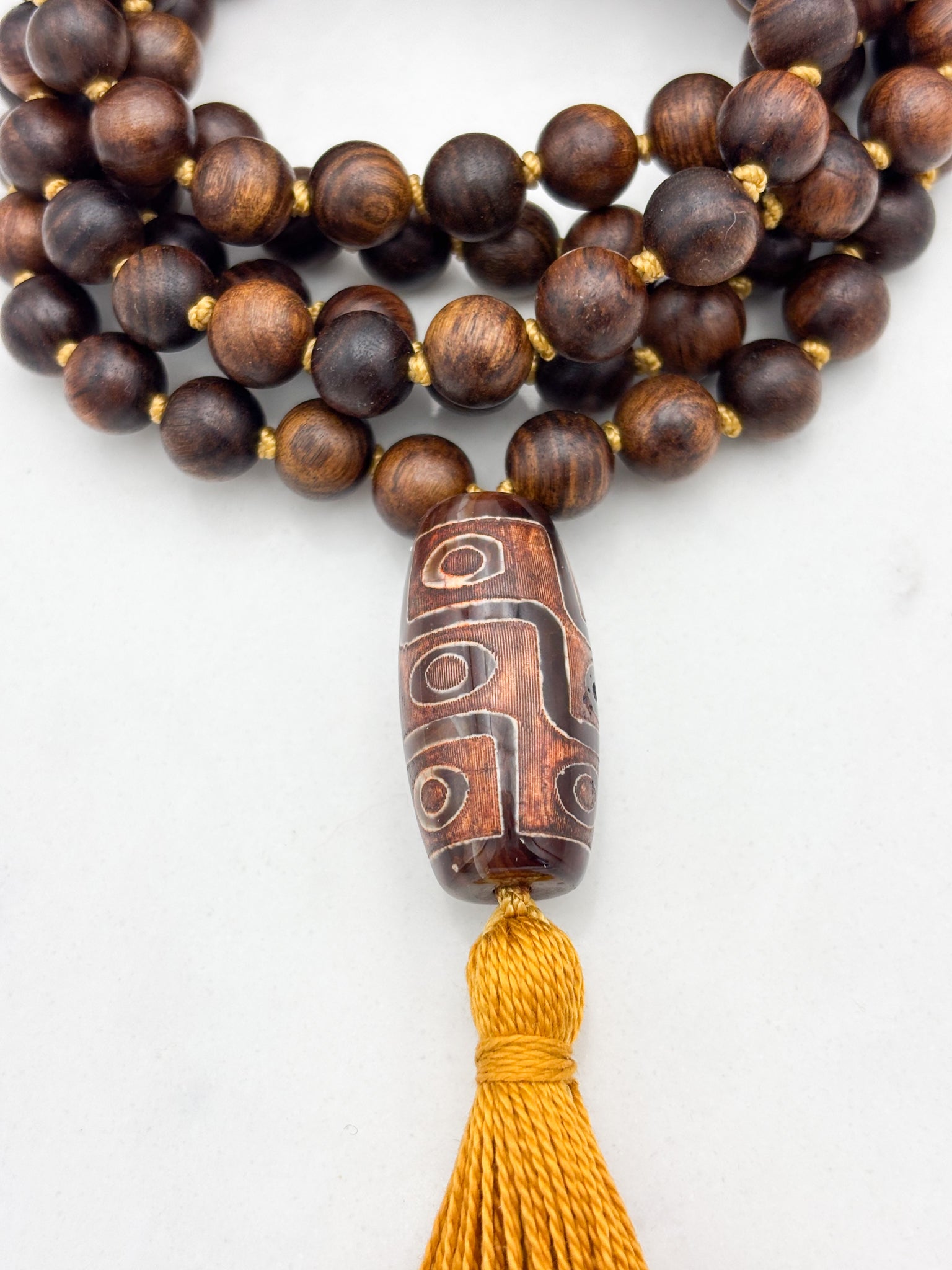 black rosewood mala with dzi agate guru bead and gold tassel  | radiant Malas | handmade in boulder, colorado