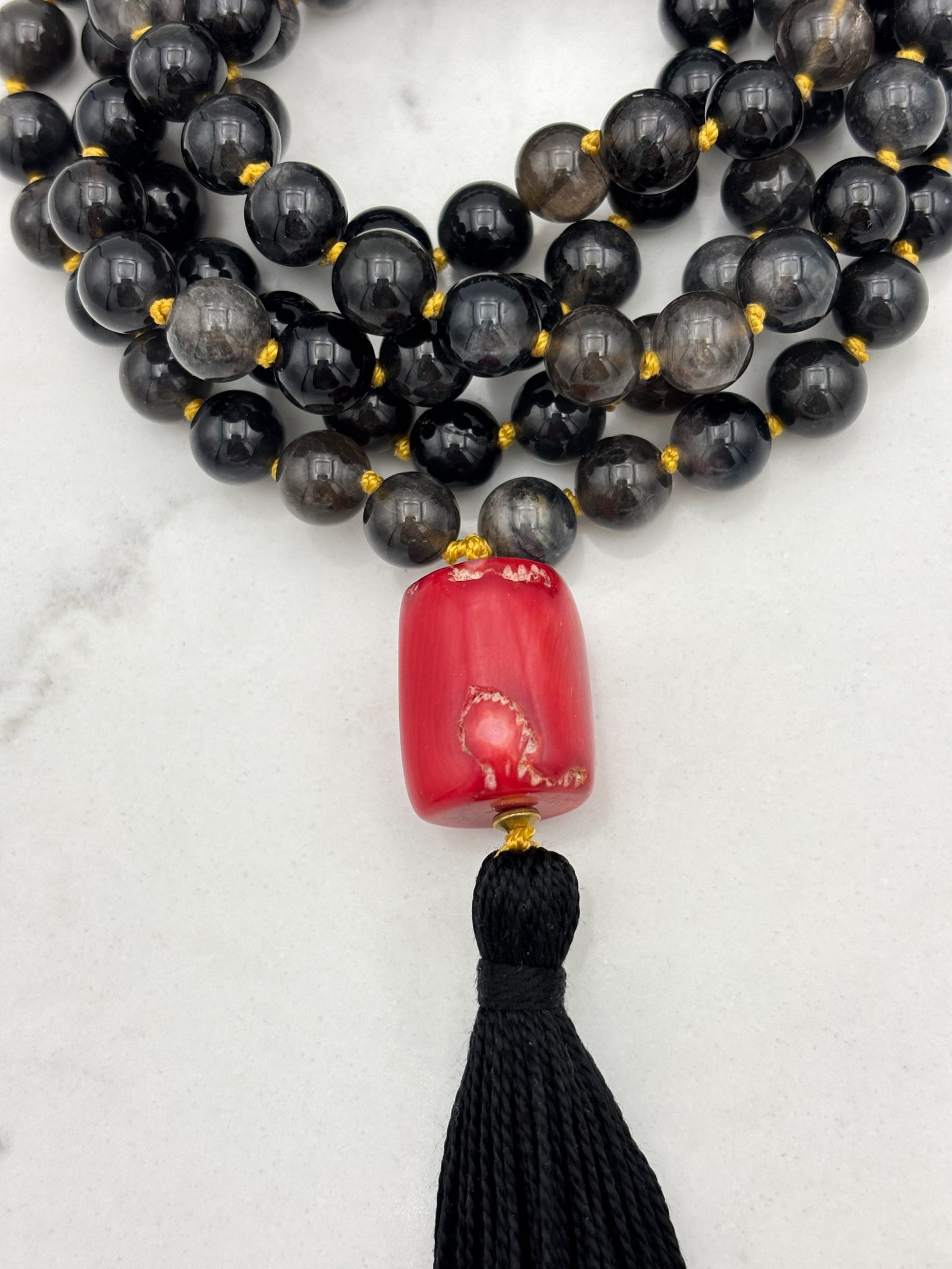 black rutile quartz gemstone mala necklace with red coral guru bead and black tassel | radiant malas | handmade in boulder, colorado