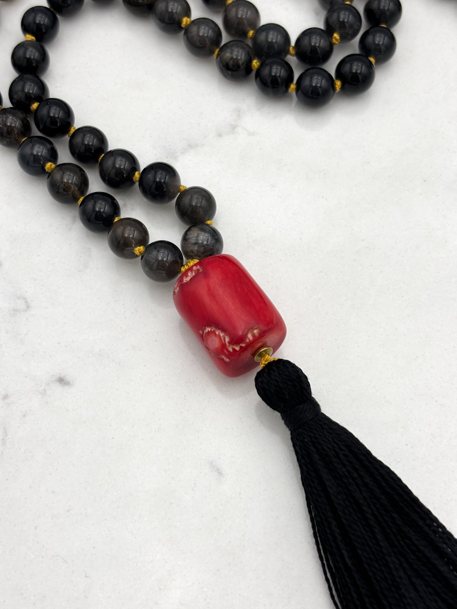 black rutile quartz gemstone mala necklace with red coral guru bead and black tassel | radiant malas | handmade in boulder, colorado
